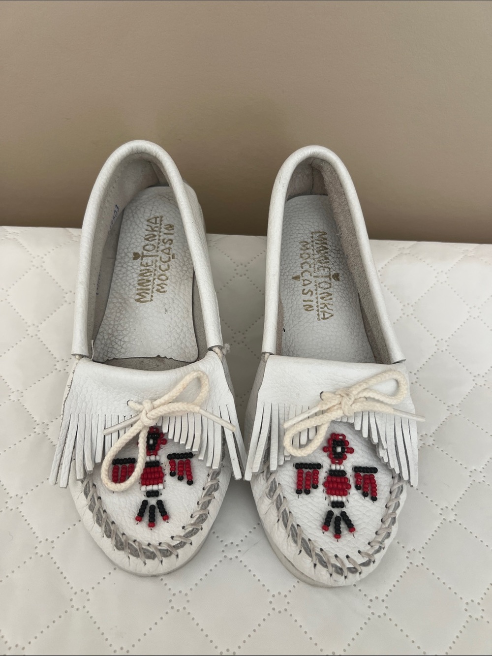 Minnetonka White Fringed Moccasins with Red & Black Bead Design